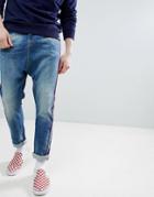 Asos Design Drop Crotch Jeans In Mid Wash Neppy Blue With Red Piping - Blue