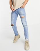 Asos Design Skinny Jeans In Vintage Mid Blue With Knee Rip And Abrasion-blues