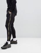 Siksilk Cropped Jogger In Black With Gold Side Stripe - Black