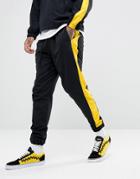 Granted Joggers In Black Nylon With Yellow Stripe - Black