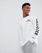 Hollister Iconic Sleeve Logo Long Sleeve Top Slim Fit In White - White