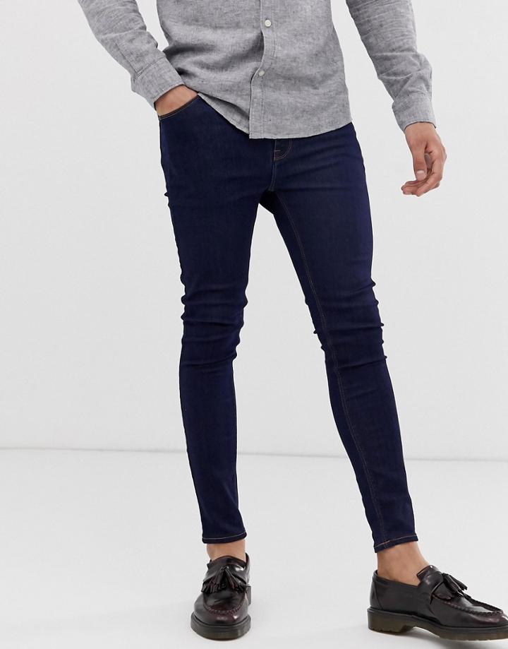 Asos Design Spray On Jeans In Power Stretch Denim In Indigo-blue