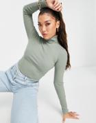 Asos Design Roll Neck Ribbed Crop Top In Khaki-green