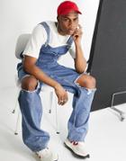 Asos Design Baggy Denim Overalls In Mid Wash With Knee Rips-blues
