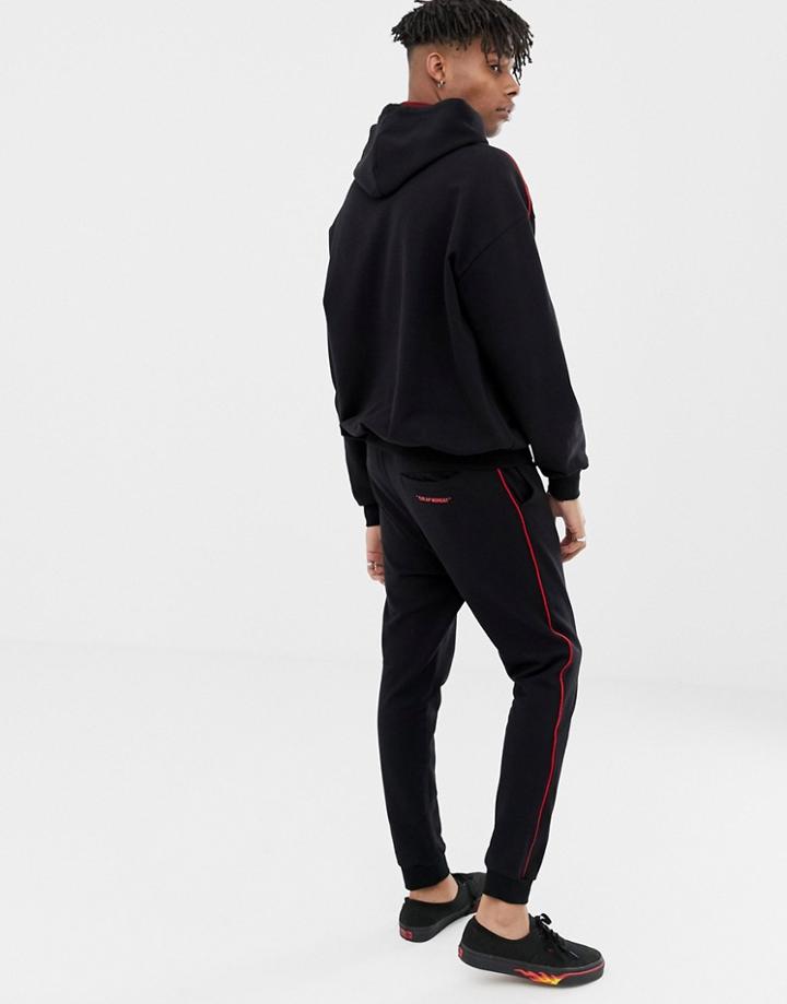 Cheap Monday Jogger Bottoms In Black With Red Stripe - Black