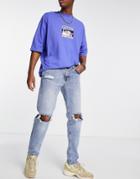 Asos Design Tapered Jeans In Mid Wash With Busted Knees And Abrasions-blue