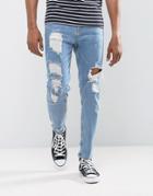Asos Tapered Jeans In Vintage Light Wash Blue With Heavy Rips - Blue