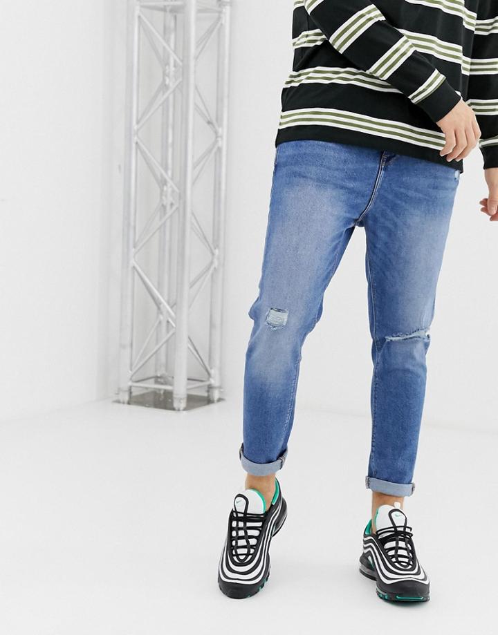 Bershka Join Life Carrot Fit Jeans With Rip And Abrasions In Mid Blue - Blue