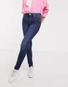 Monki Mocki Cotton Blend Mid Waist Slim Jeans In Mid Blue - Mblue-blues