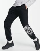Mennace Sweatpants In Black With Dragon And Logo Placement Print