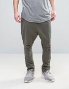 Asos Drop Crotch Chinos With Rips And Raw Hem In Dark Green - Green