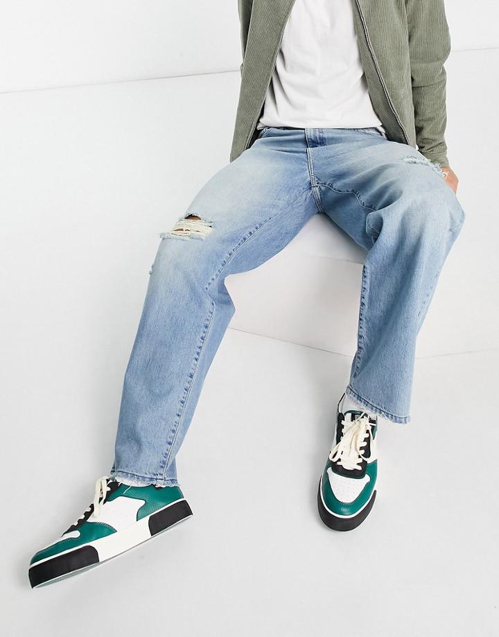 Asos Design Baggy Jeans In Tinted Mid Wash With Knee Rip-blues