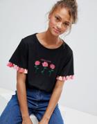 Sugar Dust Crop T Shirt With Floral Emboidery And Tassle Trim - Black