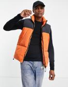 Asos Design Puffer Quilted Vest In Orange With Black Cut And Sew Panel
