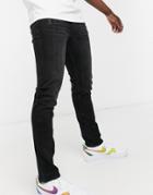 Guess Slim Tapered Jeans In Black Wash With Logo