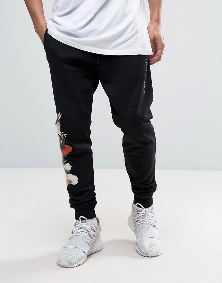 Criminal Damage Skinny Joggers In Black With Floral Print - Black