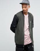 Asos Longline Jersey Bomber Jacket With Contrast Woven Sleeves - Green