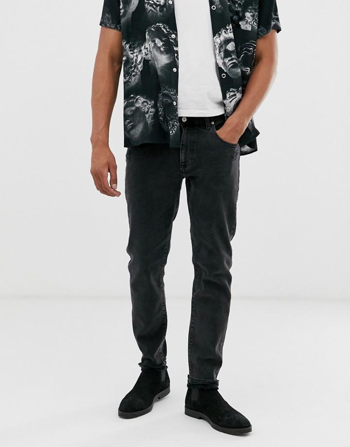 Asos Design 12.5oz Tapered Jeans In Washed Black With Destroyed Hem