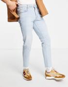 Asos Design Stretch Slim Jeans In Vintage Light Wash With Raw Hem-blues
