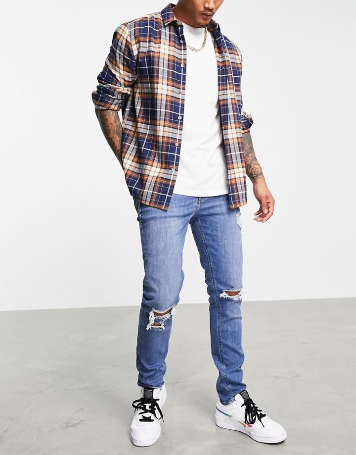 Asos Design Skinny Jeans In Mid Wash Blue With Knee Rips-blues