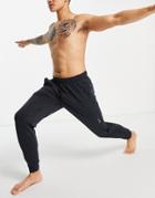 Nike Yoga Dri-fit Sweatpants In Black