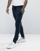 Religion Jersey Joggers In Slim Fit With Metal Badge And Zip Cuff - Navy