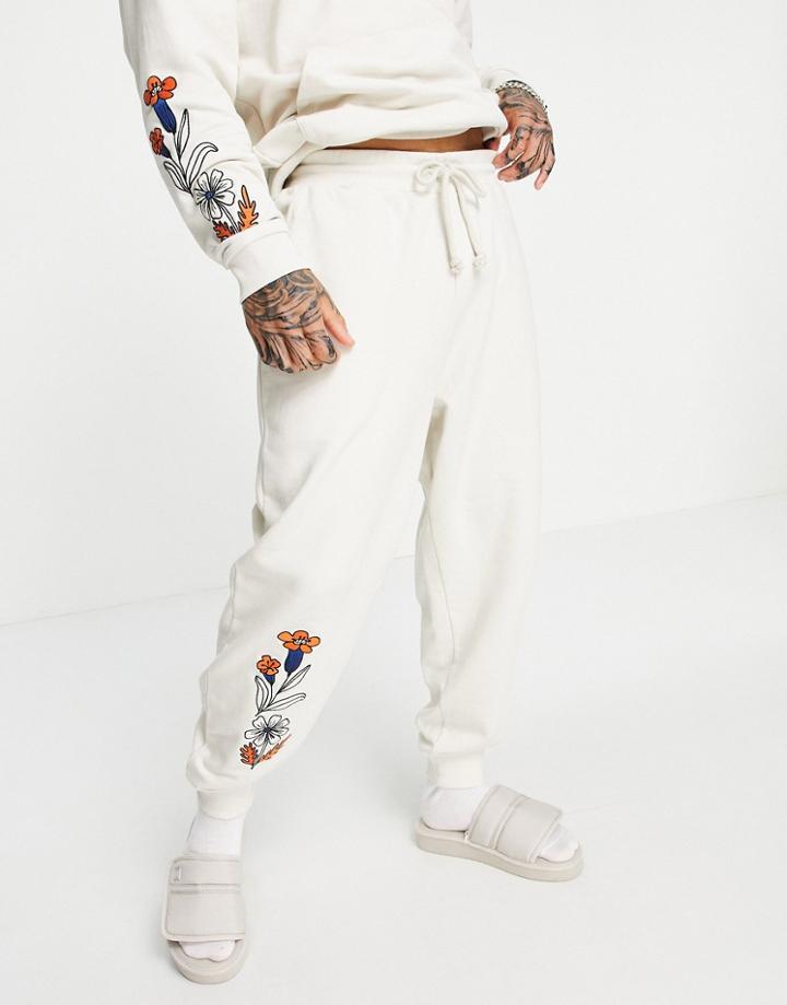 Asos Daysocial Relaxed Sweatpants With Floral Embroidery And Logo In Stone-grey