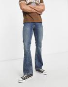 Asos Design Flare Jeans In 'less Thirsty' Tinted Mid Wash-blue
