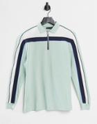Asos Design Relaxed Long Sleeve Polo Shirt With Zip Neck And Inset Panels In Pastel Green