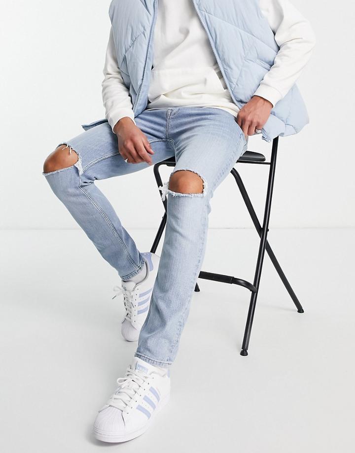 Asos Design Skinny Jeans In Light Wash With Knee Rips-blues