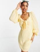 The Frolic Floral Long Sleeve Bow-front Mini Dress In Marigold-yellow
