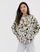 Monki Abstract Face Print Boxy Blouse In Light Beige