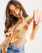 Asos Design Tie Front Crop Top With Flared Sleeve In Orange Floral-multi