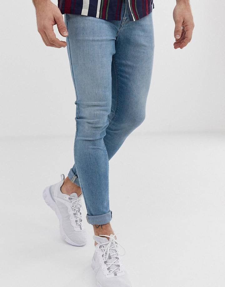 Asos Design Spray On Jeans In Power Stretch Denim In Light Wash - Blue