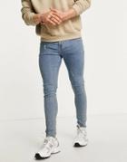 Asos Design Spray-on Jeans With Power Stretch In 'less Thirsty' Mid Wash-blues