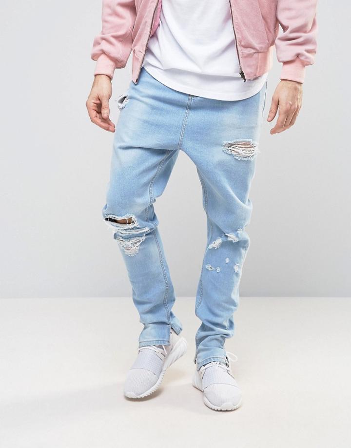 Asos Drop Crotch Stacked Jeans With Rips In Bleach Wash - Blue