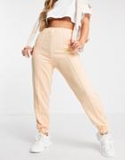 Asos Design Tonal Oversized Jogger With Pintuck In Apricot-orange