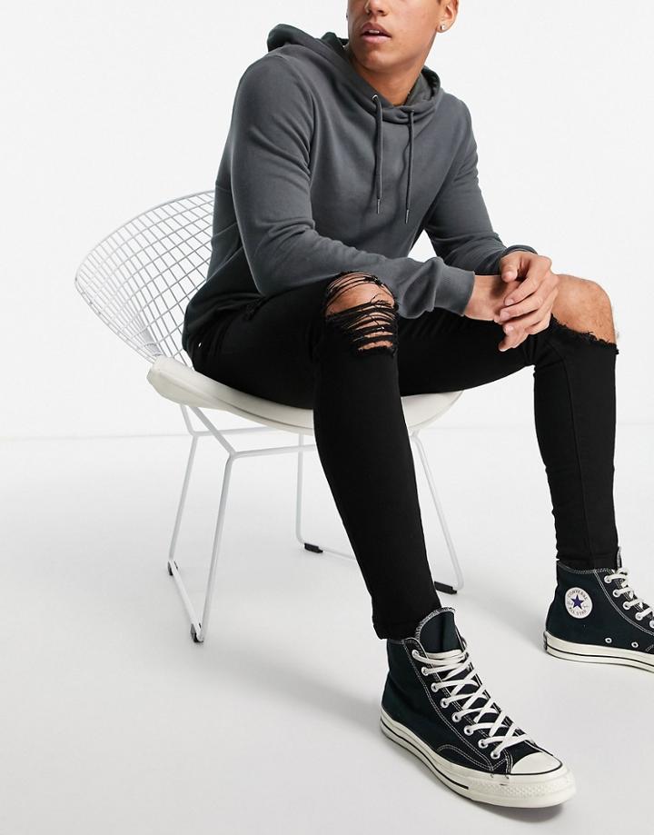 Asos Design Spray On Jeans In Power Stretch In Black With Heavy Rips