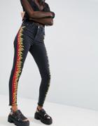 Asos Ridley Skinny Jeans In Washed Black With Skater Flame Print - Black
