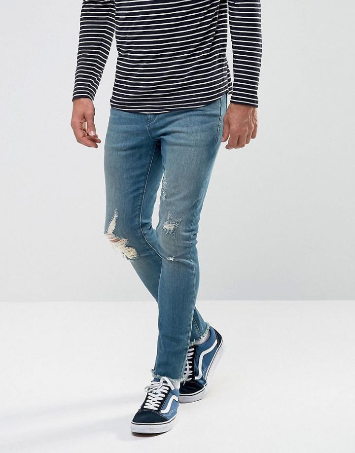 Asos Super Skinny Jeans In Dark Wash Blue With Rips And Hem Detail - Blue