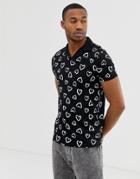 Asos Design Polo With All Over Heart Print And Revere Collar - Black