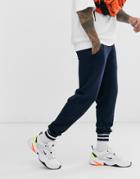 Asos Design Tapered Sweatpants In Navy With Striped Rib