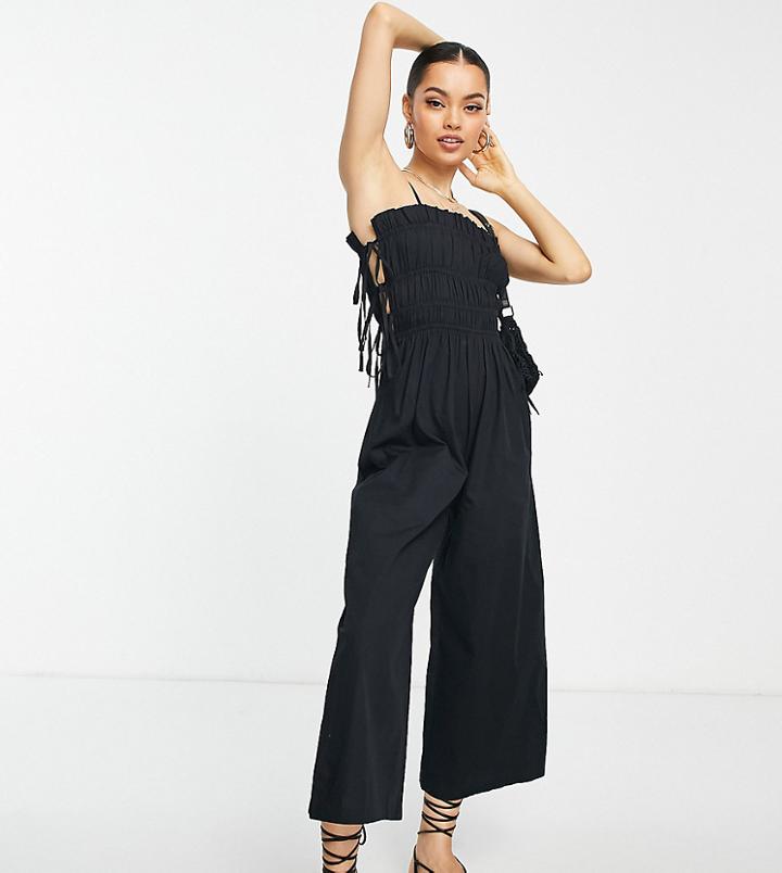 Asos Design Petite Shirred Strappy Jumpsuit With Tie Side Detail In Black