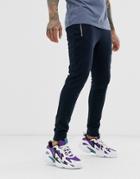 Asos Design Skinny Sweatpants In Navy With Rose Silver Zip Pockets