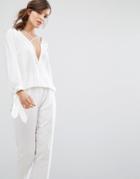 Parallel Lines Drape Front Top With Cross Strap Detail And Tie Cuffs -