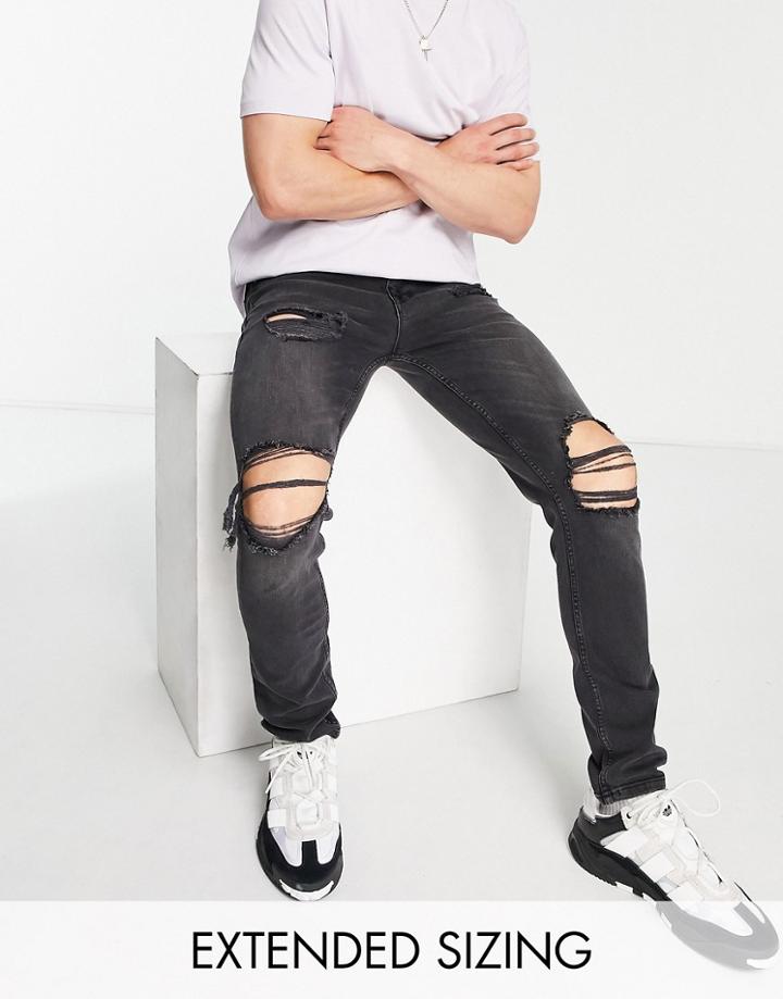 Asos Design Skinny Jeans In Washed Black With All Over Rips