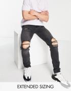 Asos Design Skinny Jeans In Washed Black With All Over Rips