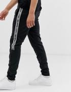 Hollister Leg Logo Side Piping Cuffed Sweatpants In Black