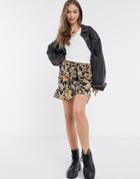 Urban Bliss Tie-front Mini Skirt With Ruffle Hem In Black Floral
