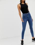 Asos Design Ridley High Waisted Skinny Jeans In Mid Wash Blue
